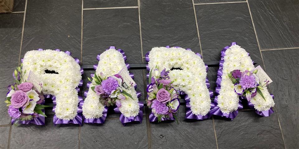based floral letter funeral tribute Camborne